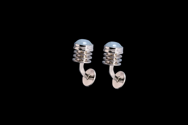 silver cufflinks with aquamarine, black background